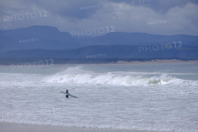Waves on the beach with dark sky