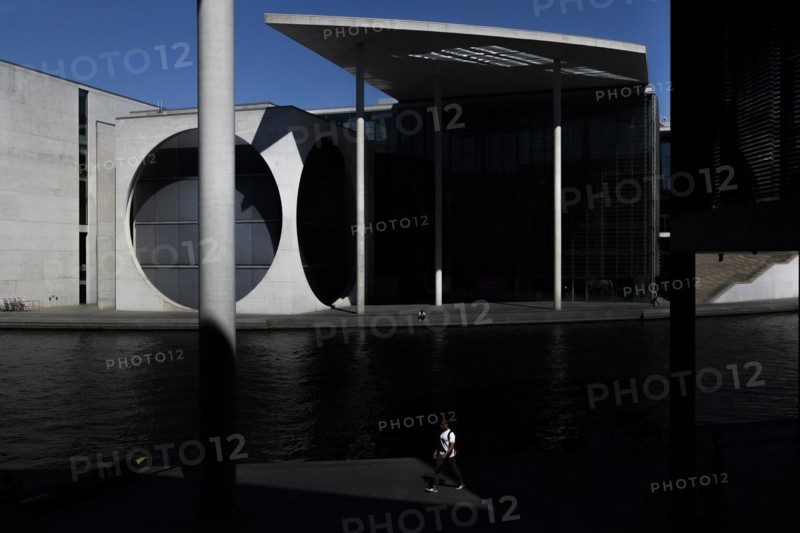 A person stands out at the Spreebogen in front of the Paul-Loebe-Haus at the Spreebogen in Berlin