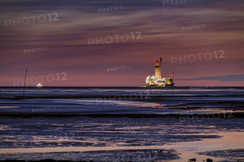 Germanys only oil rig Mittelplate at night and low tide