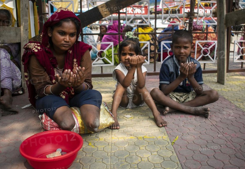 Indian Muslim woman with children perform the second Friday prayer in the holy month of Ramadan near a Mosque in Guwahati