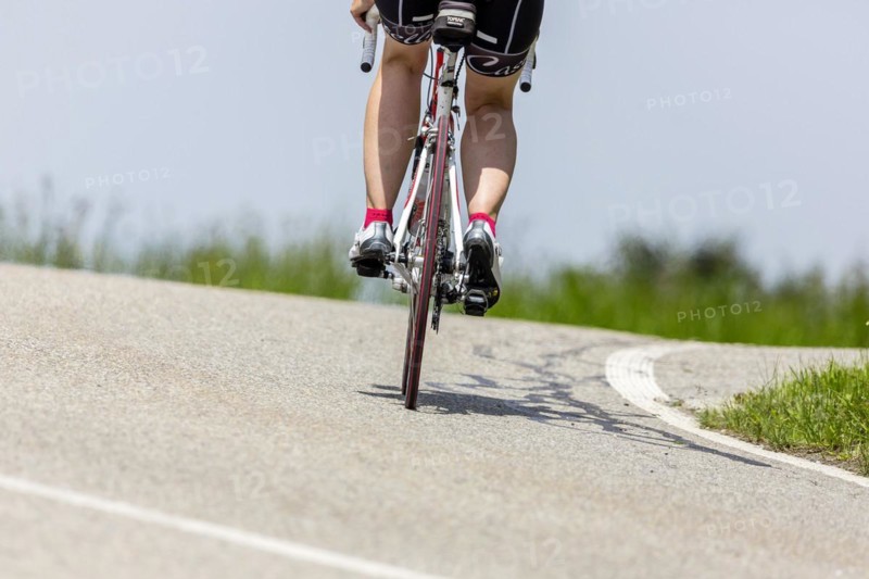 Cyclist with racing bike in the idyllic Lautertal