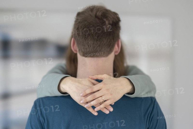 Young couple with engagement ring.