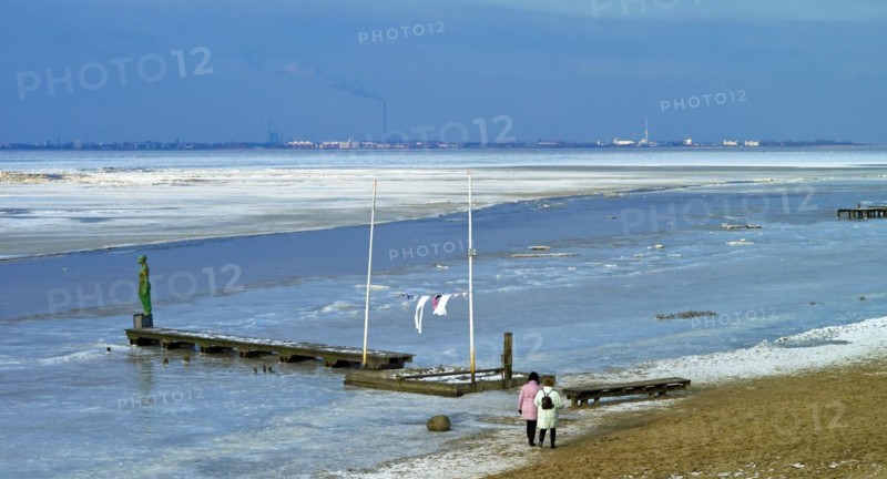 View over the frozen Jade Bay towards Wilhelmshaven