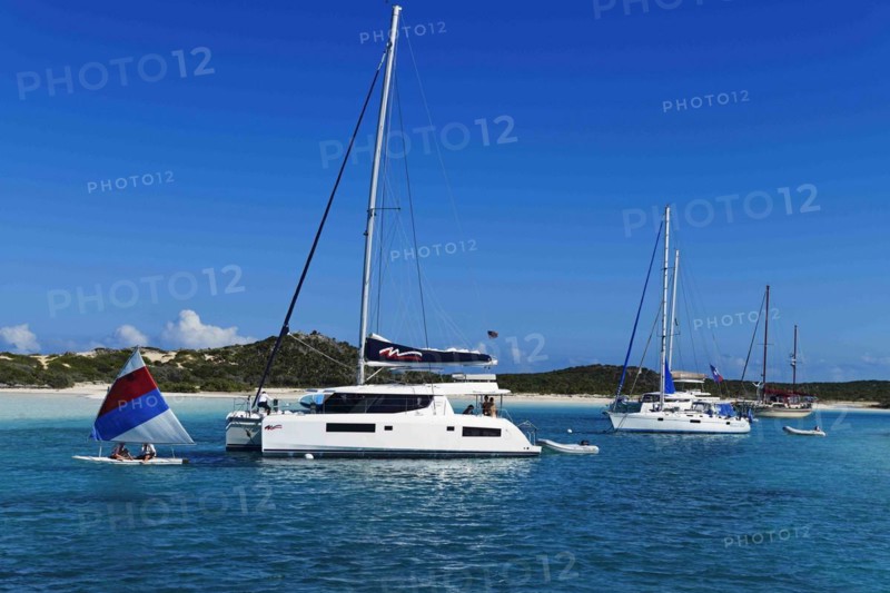 Sailboats and catamarans anchor off Warderick Wells