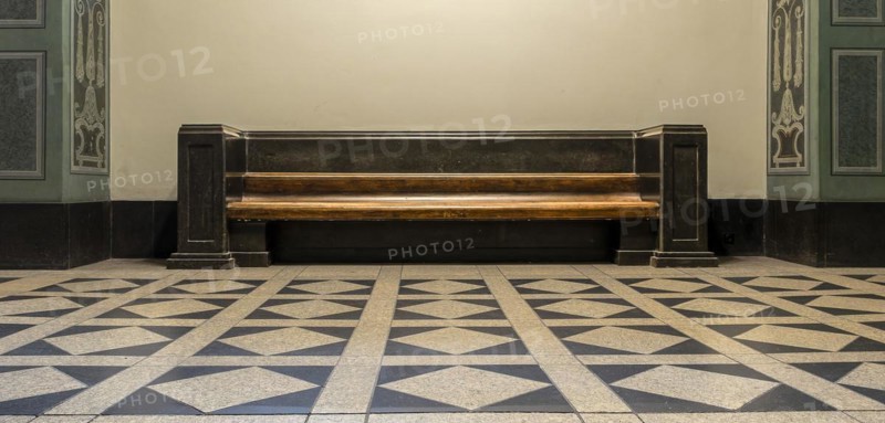 Wooden bench in retro style in the vestibule of Spandau Town Hall