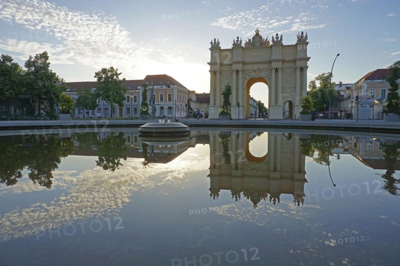 Reflection Brandenburg Gate in water basin