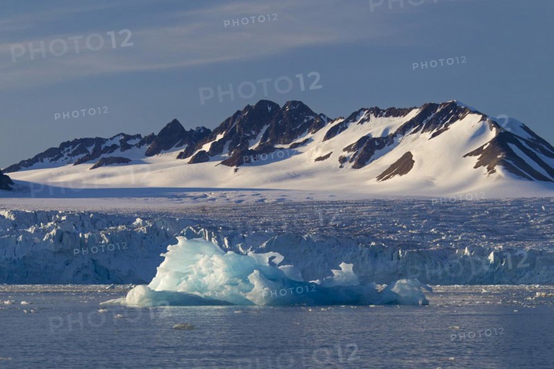 Calved iceberg from the Lilliehoeoekbreen glacier drifting in the Lilliehoeoekfjorden