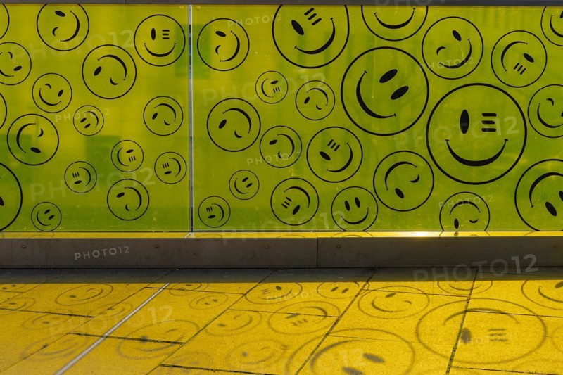 Yellow plastic wall with smileys