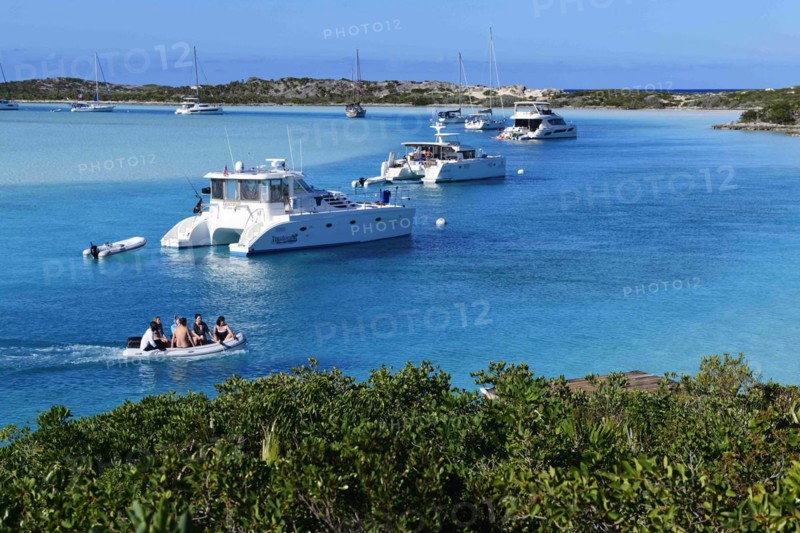 Sailboats and catamarans anchor off Warderick Wells