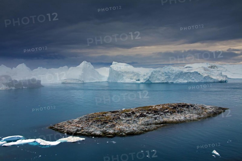 Icebergs at sunset in the Kangia icefjord