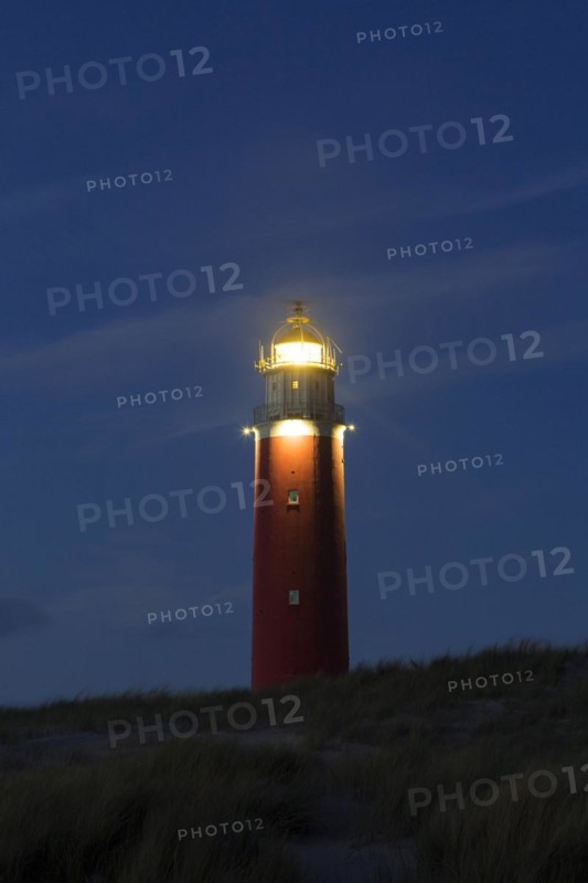 Eierland Lighthouse in the dunes at sunset on the northernmost tip of the Dutch island of Texel
