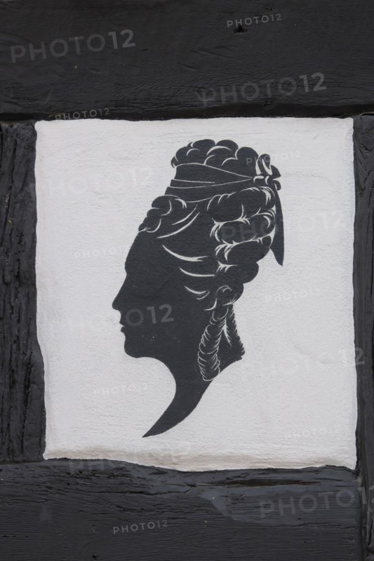 Woman's hairstyle at the half-timbered house of the hairdresser's salon
