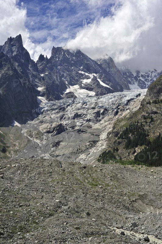 Retreating glacier in July 2009 in the Mount Blanc massif seen from the Val Veny valley showing moraine and polished bedrock