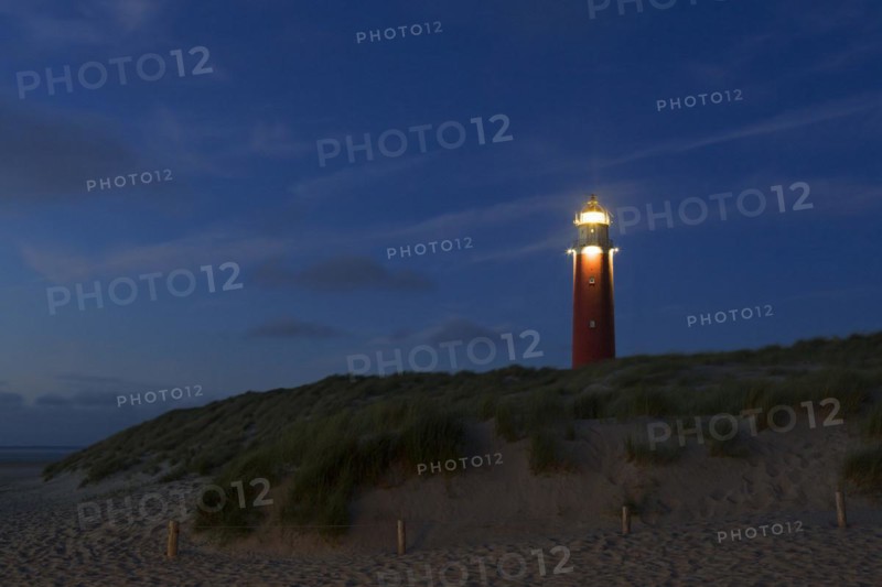 Eierland Lighthouse in the dunes at sunset on the northernmost tip of the Dutch island of Texel