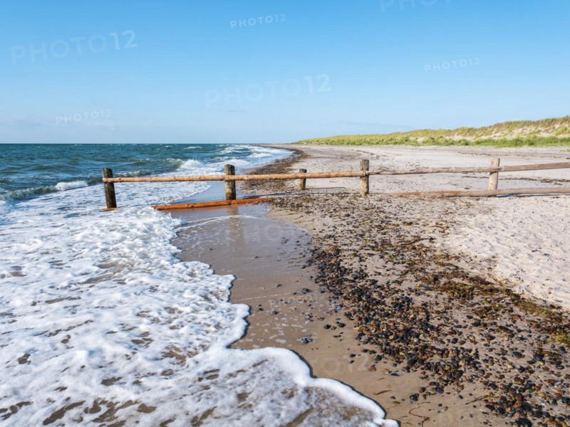 Fence on the beach of the Baltic Sea as the border of the closed-off core zone of the National Park Vorpommersche Boddenlandschaft