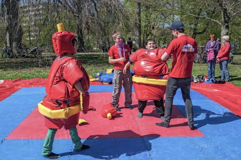 Children playing as sumo wrestlers in springtime Luitpoldpark