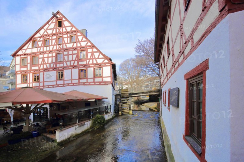 Half-timbered house Lochmuehle with mill wheel on the Grosse Blau stream in Gerbergasse