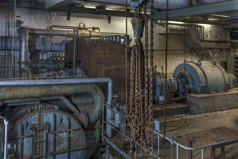 Chains from a pulley block in the pump room of a former paper factory