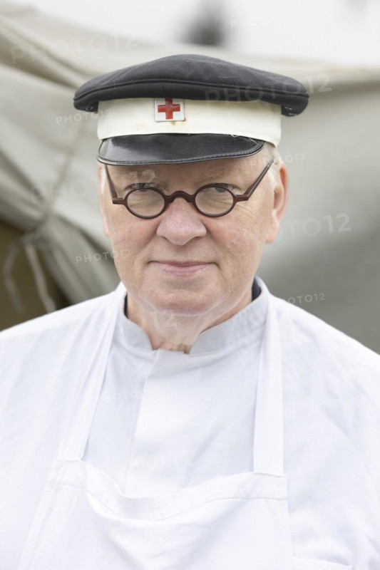 Volunteer of the Red Cross presents a historical outfit