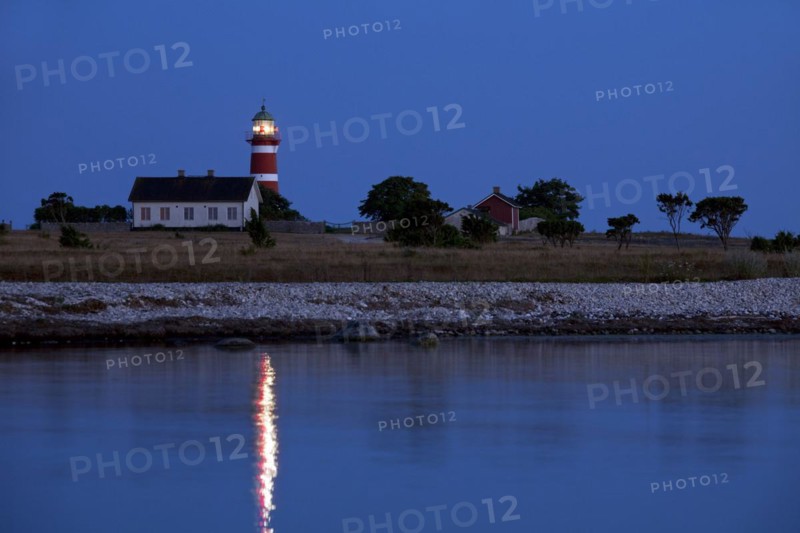 The red and white lighthouse Naers fyr at Naersholmen on the island Gotland