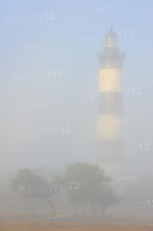 The lighthouse phare de Chassiron in the mist at Saint-Denis-dOleron on the island Ile dOleron