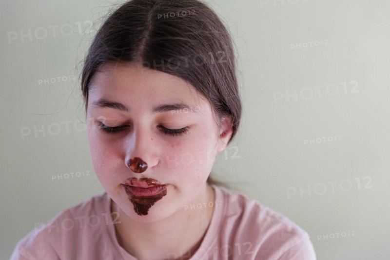 Girl with a chocolate-smeared mouth