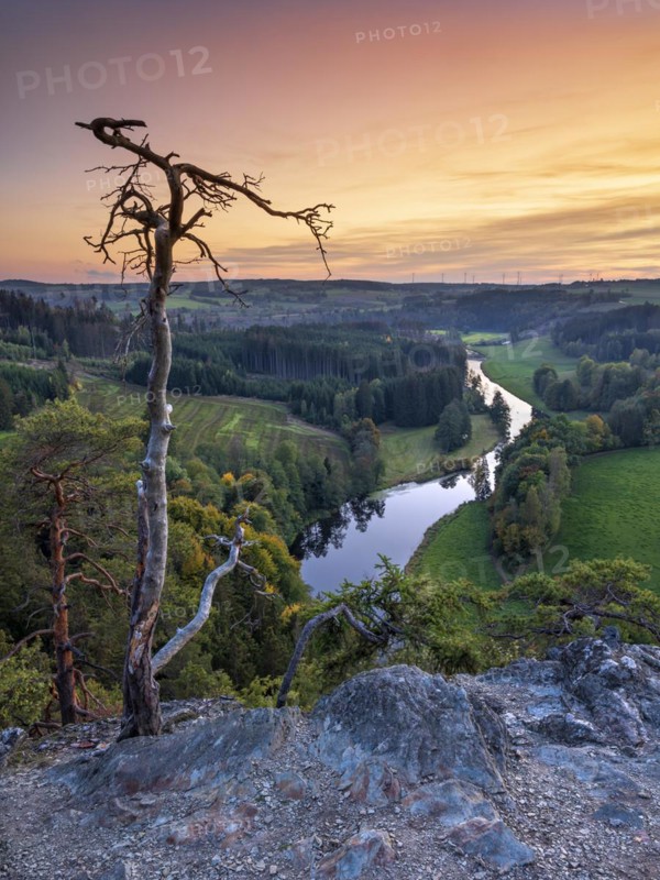 View from Petersgrat in the Franconian Forest of the river Saale at sunset