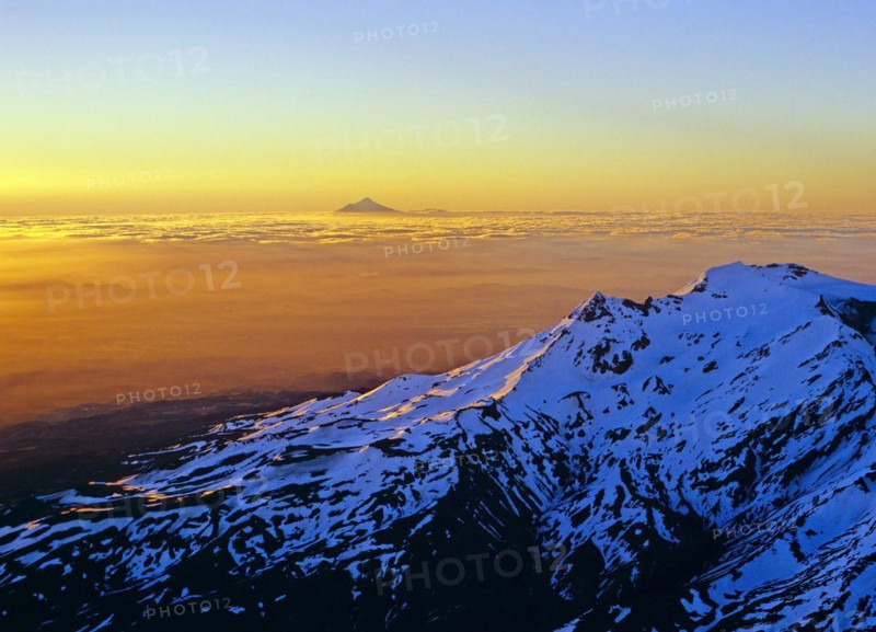 Aerial view of Mount Ruapehu with Mount Taranaki seen in the far distance North Island New Zealand