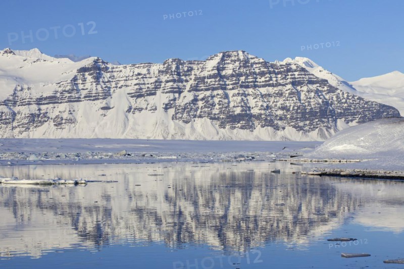 Snow covered mountains along the Joekulsarlon glacier lagoon in winter