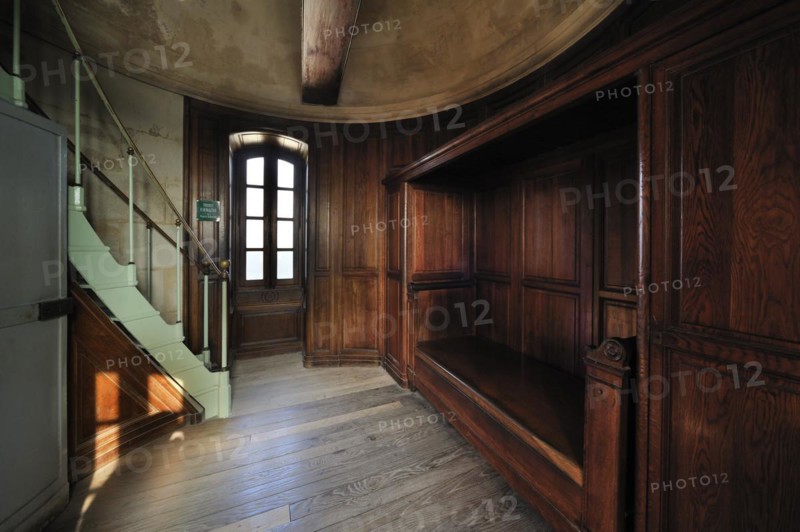 Wooden bed in bedroom inside the lighthouse Phare des Baleines on the island Ile de Re