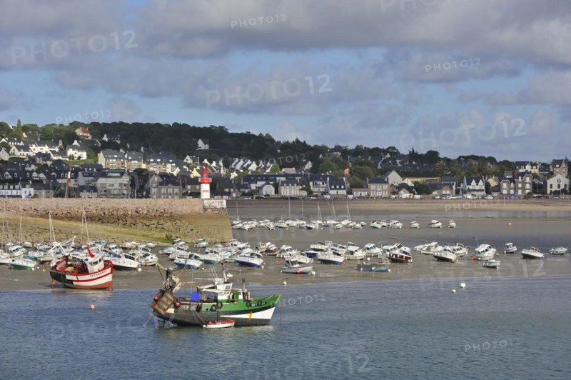 Fishing boats and sailing boats in the harbour of Erquy at low tide