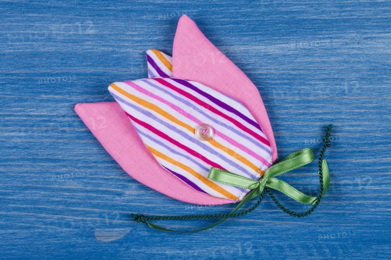 Fabric tulip on blue background