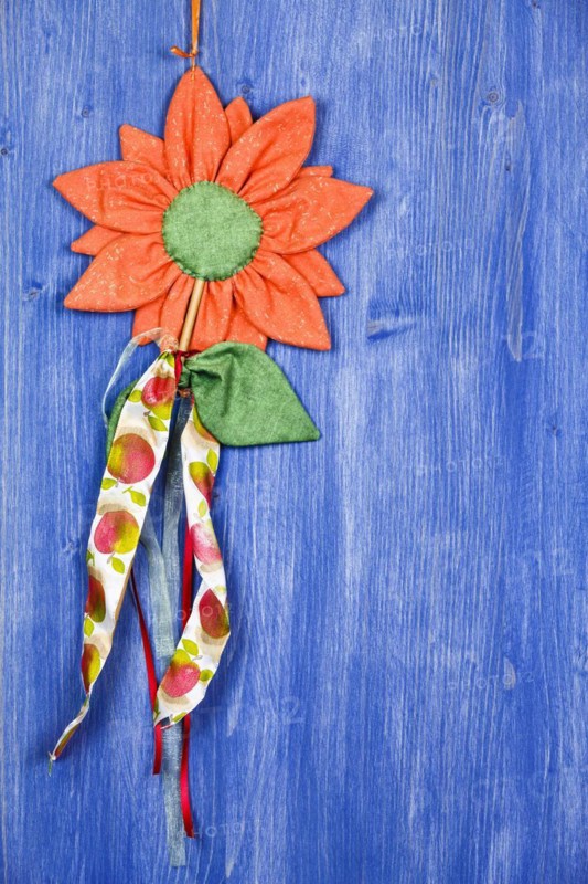 Fabric flower on blue background