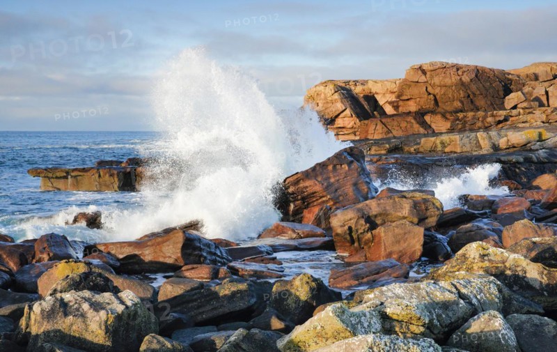 Water dashing against rocks on the rocky coast of Isle of Skye