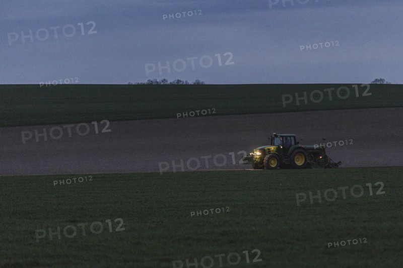 A tractor with a seed drill photographed Reichenbach Oberlausitz