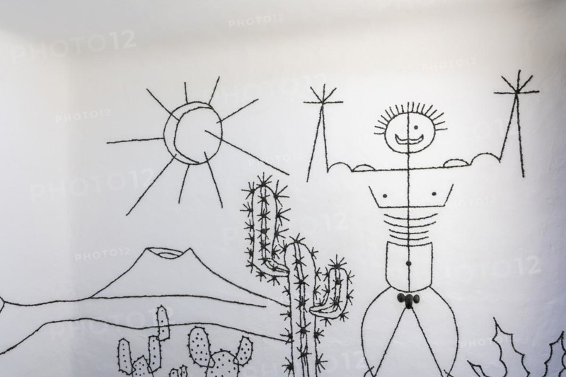 Artfully designed sign at the men's toilet