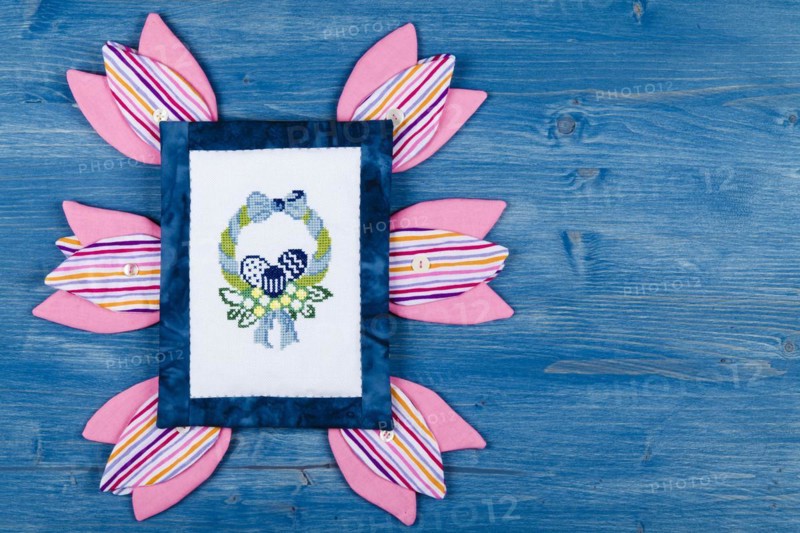 Embroidery design surrounded with fabric tulips