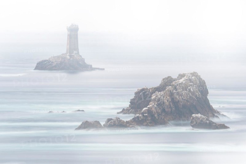 The lighthouse La Vieille in the strait Raz de Sein in thick fog
