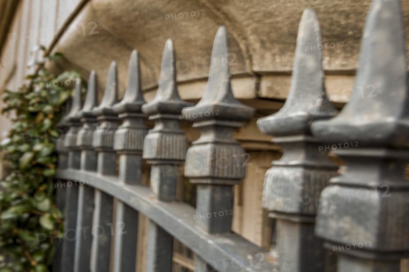 Iron fence in front of a building