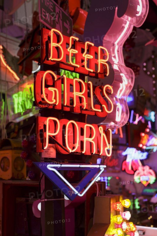 Room full of bright colourful neon signs
