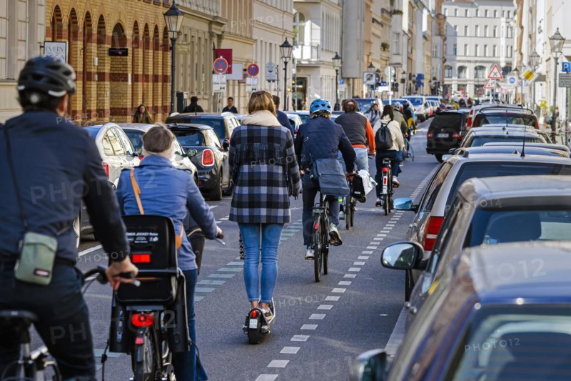 Symbolic photo on the subject of bicycle lanes in the city. Cyclists ride on the bicycle street in Linienstrasse in Berlin Mitte. Berlin