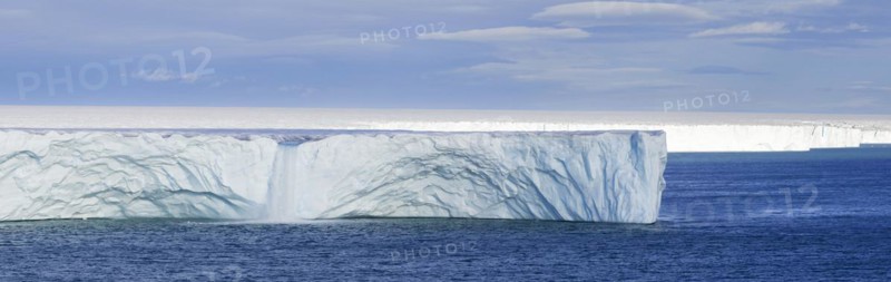 Waterfall at edge of the Brasvellbreen glacier from the ice cap Austfonna debouching into the Barents Sea