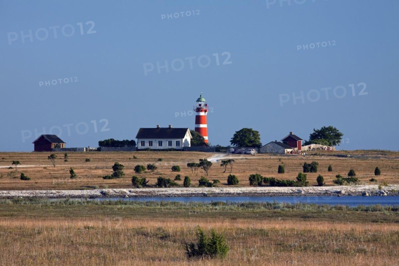 The red and white lighthouse Naers fyr at Naersholmen on the island Gotland