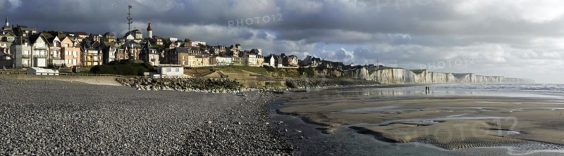 View over the chalk cliffs and the village Ault seen from the pebble beach