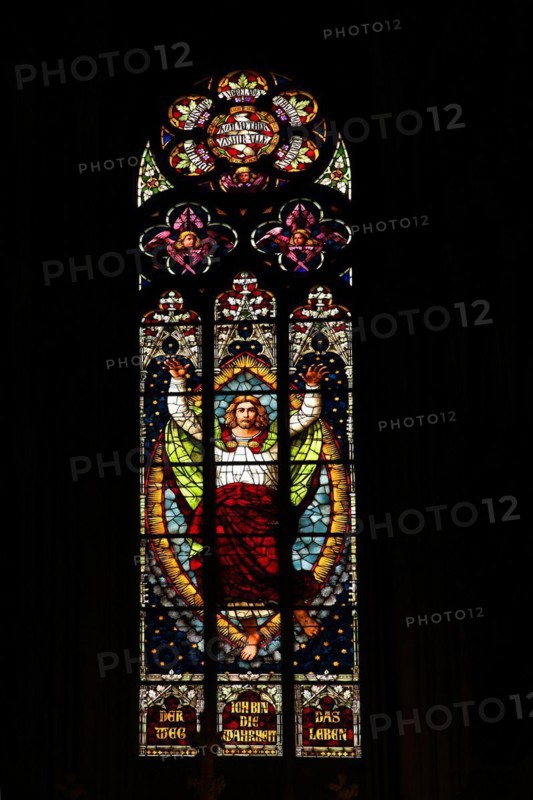 Stained glass window with Jesus at the blessing with biblical quote : I am the way and the truth and the life