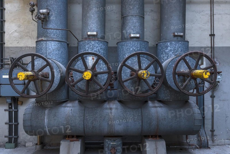 Large steam regulators in a former paper factory