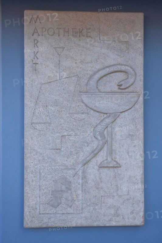Emblem of the pharmacy and historical pharmacy with inscription