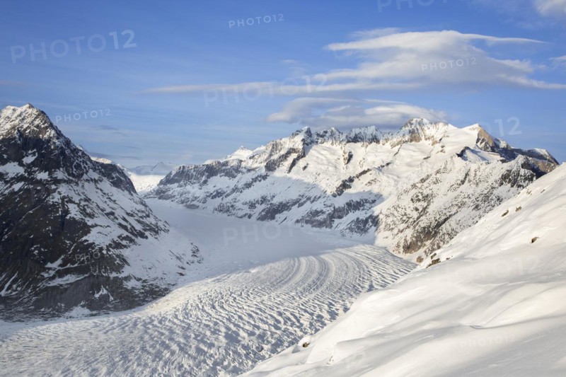 View over the mountains in winter surrounding the Swiss Aletsch Glacier