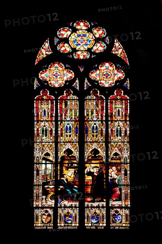 Stained glass window with John Calvin and Guillaume Farel in Geneva