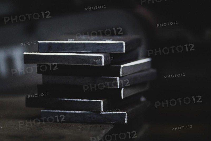 Metal plates lying on a workbench